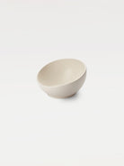 White bowl with sloping rim